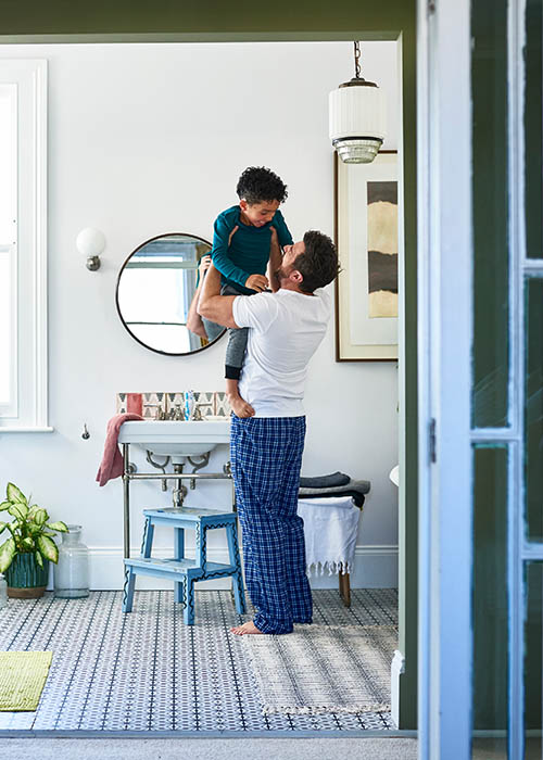 Man lifting his child - Getting the child ready.
