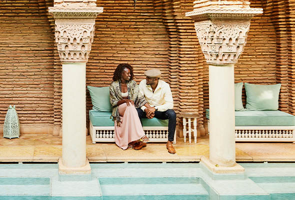 Couple relaxing by the pool