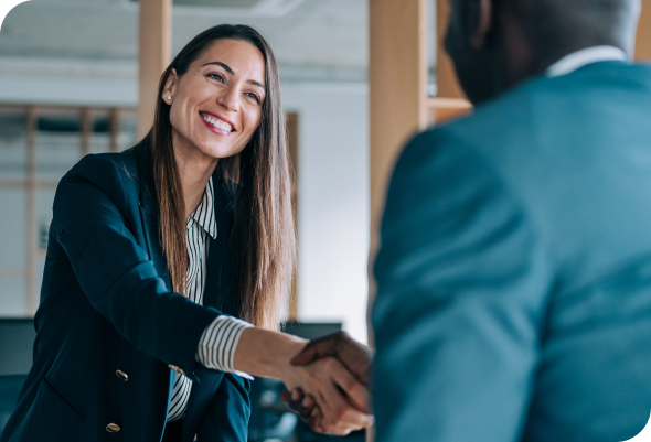 Two people shaking hands to start a relationship