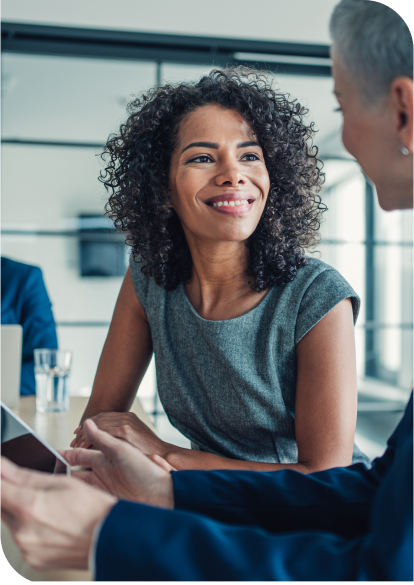 Smiling woman looking at her advisor.