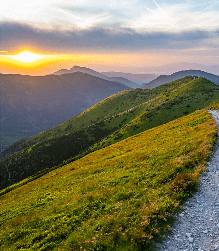 Multiple hills during a sunset.