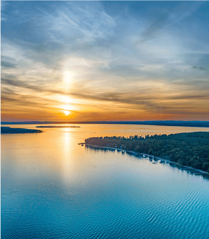 A huge lake during a beautiful sunset.